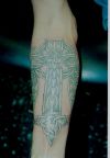 cross celtic tattoo on arm